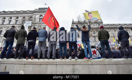 London, UK.  27 January 2018.  Protesters in Whitehall as thousands of Kurdish people march from the BBC's Headquarters in Portland Place to Downing Street to protest against Turkey's military invasion of the city of Afrin in Northern Syria, a predominantly Kurdish city.  Protesters called for the British public to show solidarity with the people of Afrin and for the UK to demand that Turkey pull back its forces. Credit: Stephen Chung / Alamy Live News Stock Photo