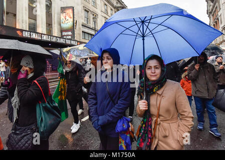 London, UK.  27 January 2018.  Protesters walk down Whitehall as thousands of Kurdish people march from the BBC's Headquarters in Portland Place to Downing Street to protest against Turkey's military invasion of the city of Afrin in Northern Syria, a predominantly Kurdish city.  Protesters called for the British public to show solidarity with the people of Afrin and for the UK to demand that Turkey pull back its forces. Credit: Stephen Chung / Alamy Live News Stock Photo