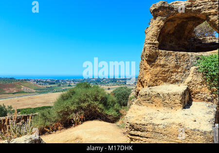 Summer sea coast and famous ancient ruins in Valley of Temples, Agrigento, Sicily, Italy. UNESCO World Heritage Site. Stock Photo