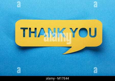 Thank You Text On Yellow Speech Bubble Made Of Paper Stock Photo