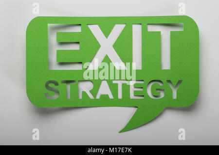 Elevated View Of Exit Strategy Text On Green Speech Bubbble Stock Photo