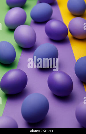 Purple easter eggs on a colored background Stock Photo