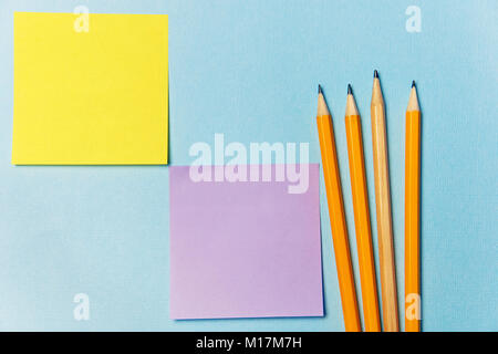 stickers for recording and pencils. Office theme on blue background Stock Photo