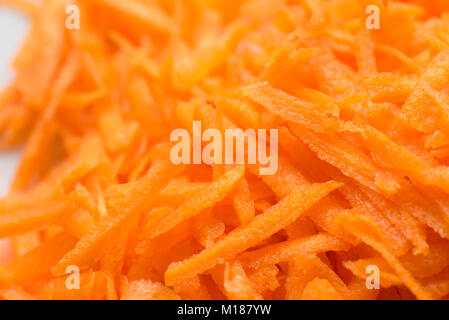 raw grated carrot on plate Stock Photo