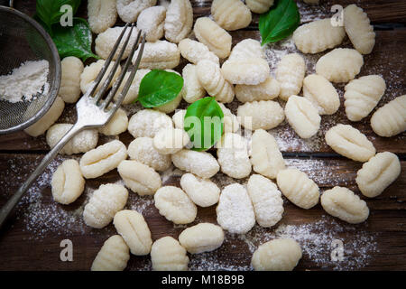 preparing fresh potato gnocchi on wood board Stock Photo