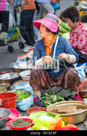 Market vendors in Busan vegetable market, South Korea. Stock Photo