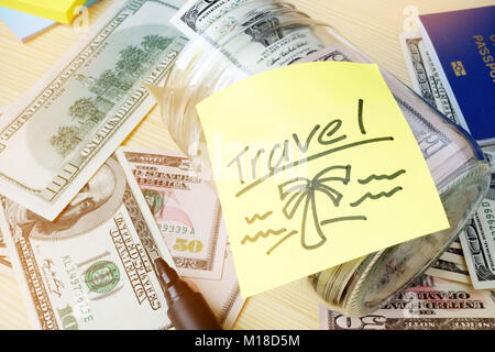 Savings for vacation concept. Jar with written word travel. Stock Photo