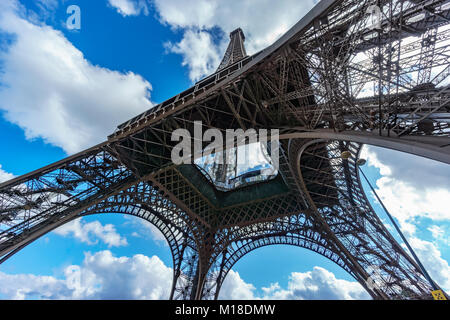 The Eiffel Tower bottom view of legs over blue sky Stock Photo