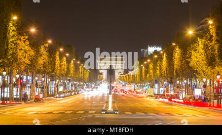 Boulevard Champs-Elysées with traffic,rear triumphal arch,Paris,France Stock Photo