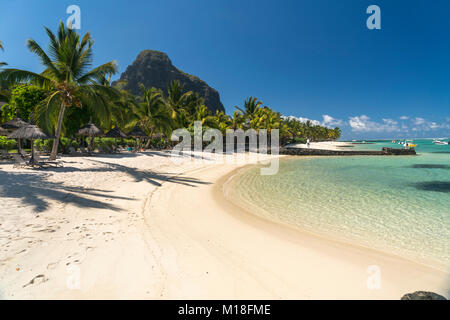 Beach with palm trees,mountain Le Morne Brabant in the background,peninsula Le Morne,Black River,Mauritius Stock Photo