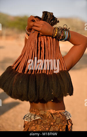 Hair and arm jewellery of a young married woman,Kaokoveld,Namibia Stock Photo