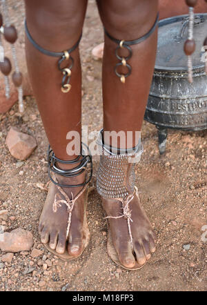Leg jewellery of a young married Himbafrau,Kaokoveld,Namibia Stock Photo