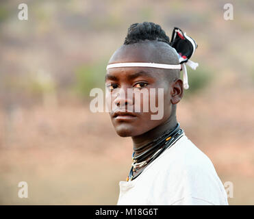 Young Himba man with traditional hairstyle,Portrait,Kaokoveld,Namibia Stock Photo