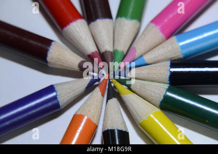 Circle of Coloured Pencils with the tips meeting in the middle Stock Photo