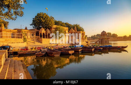 Gadi Sagar Lake (Gadisar) - A popular tourist destination with ancient architecture in Jaisalmer Rajasthan at sunrise. Stock Photo