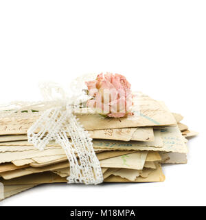 Stack of old love letters (1890-1910), lace and rose flower Stock Photo