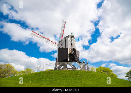 Windmill in Bruges, Northern Europe, Belgium. Historical building preserved for tourism in the city, along the canals. Stock Photo