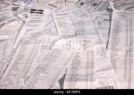 A pile of itemised shopping receipts / bills for multiple purchases - mainly at supermarkets - in British sterling currency. England, UK. Stock Photo