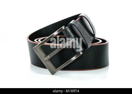 Rolled black leather belt with metal buckle isolated on white background in close-up Stock Photo