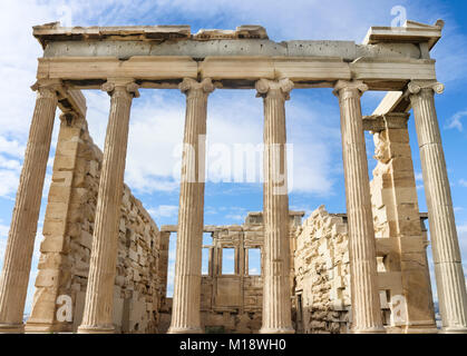 View from below of the Erechtheion temple of Athena on the Athens Acropolis against a very blue sky with wispy clouds Stock Photo