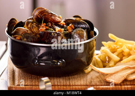 Closeup mussels in saucepan. Stock Photo