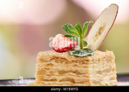 Closeup mille-feuille napoleon with apple and straberry slices. Stock Photo