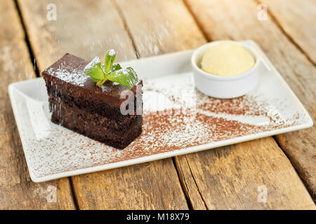 Rain of flour on cake. Stock Photo