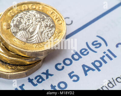 HM Revenue and Customs tax return and self assessment form with some loose change - people having to 'sharpen the pencil' to pay taxes Stock Photo