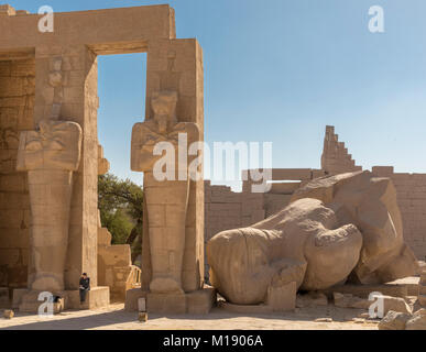 Huge fallen statues of Ramses II in the Ramesseum at Thebes, Egypt. One ...