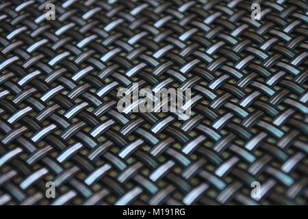 A captivating metallic pattern adorned with shades of white, black, and gray, creating an alluring visual display. Stock Photo