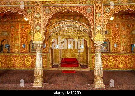 Junagarh Fort Bikaner Rajasthan royal palace interior architecture details with emperor throne and glass gold artwork decorations. Stock Photo