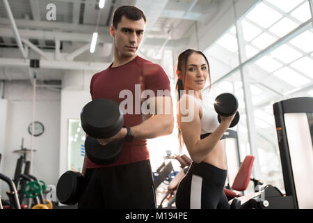 Fit Couple Posing in Gym Stock Photo