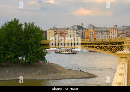 Margaret island and Margaret bridge against row of old houses on Pest river side, Budapest Stock Photo