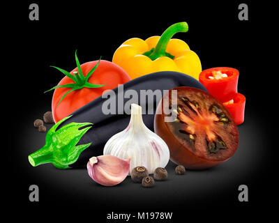 Group of vegetables. Eggplant, tomato, pepper and garlic on black background. Stock Photo