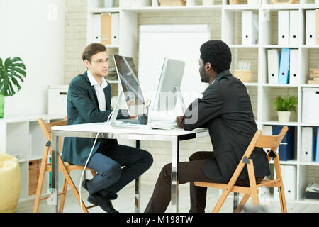 Young Professionals Working in Office Stock Photo