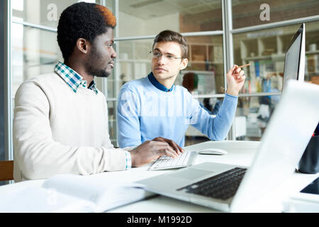 Two IT Programmers Working in Office Stock Photo