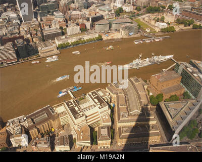 A view looking down from the top viewing floor, 72, of The Shard, London to the River Thames and HMS The Belfast in the pool of London Stock Photo