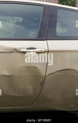 Dents in the side of car Stock Photo