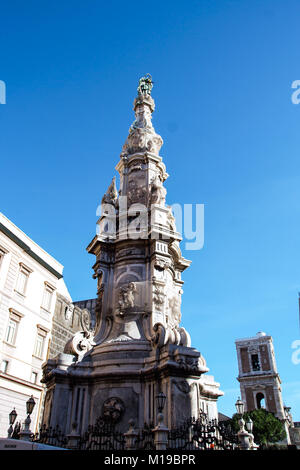 Guglia dell'Immacolata, baroque column vowed to the holy virgin and Santa Chiara church  in Naples, Italy Stock Photo