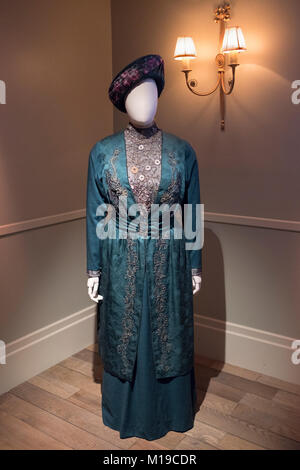 One of Maggie Smith's costume dresses on display at Downton Abbey The Exhibition on West 57th Street in Midtown Manhattan, New York City. Stock Photo