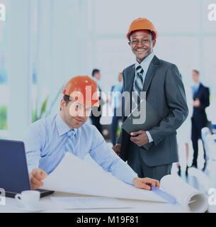 Architects working on construction project. Stock Photo