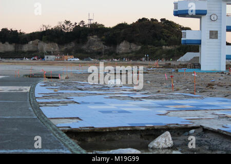 (4 November 2015 , Soma, Fukushima, Japan) A pavement destroyed by Tsunami disaster in Matsukawaura beach, Soma,city Japan. The beach, which is considered a local touristic point,  has been closed due to under construction and decontamination process for 6 years since 2011 Tsunami-earthquake disaster and its aftermath. Soma city is planning to finish the process of reconstruction and decontamination in order to reopen the beach for tourists from 2018 onward. Stock Photo