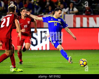 Los Angeles, USA. 28th Jan, 2018. Ognjen Todorovic (R) of Bosnia and Herzegovina shoots during an international friendly soccer match between the United States and Bosnia and Herzegovina in Los Angeles, the United States, Jan. 28, 2018. The match ended with a 0-0 draw. Credit: Li Ying/Xinhua/Alamy Live News Stock Photo