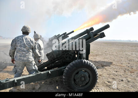 111023-Z-XQ016-004 Members of Bravo Troop, 1-144th Field Artillery Battalion, California Army National Guard pulls shoot off cannons during the Wings, Wheels and Rotors Expo at Joint Forces Training Base Los Alamitos Oct. 23. Four cannons shot a total of 13 rounds to signify the arrival of Maj. Gen. David Baldwin, the adjutant general for the California National Guard. (Army National Guard photo/Staff Sgt. Emily Suhr) Stock Photo