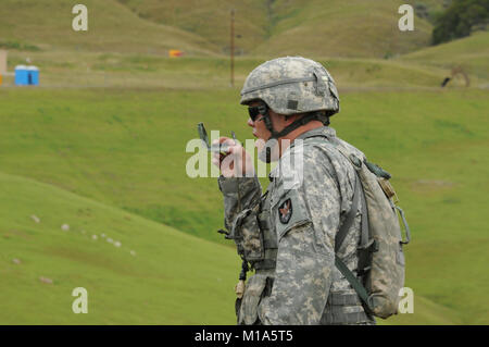 120423-Z-PP889-005 Staff Sgt. Eugene A.K. Patton Jr., an intelligence analyst with the Colorado Army National Guard’s 117th Space Battalion, takes a finer look at his compass during the land navigation event in the 2012 Region VII Best Warrior Competition at Camp San Luis Obispo, Calif., April 23. The California Army National Guard is hosting the competition to Army Guardsmen from eight states including Arizona, California, Colorado, Guam, Hawaii, Nevada, New Mexico, and Utah. The 2012 Region VII BWC will test competitors on the new Army Combat Readiness Test, day and night land navigation, a  Stock Photo