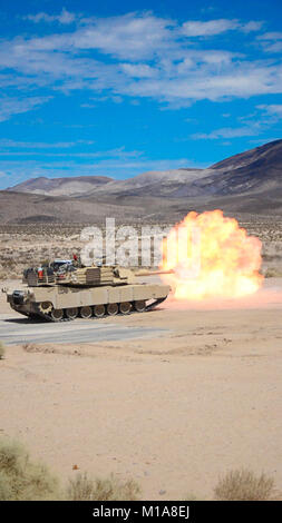 NTC FORT IRWIN - An M-1 Abrams tank belonging to the 1st Battalion, 185th Armor Regiment (Combined Arms Battation) fire rounds down range at National Training Center Fort Irwin. The 185 CAB Soldiers operating the tanks were conducting firing tables as part of their annual training for the California Army National Guard. (U.S. Army photo by Sgt. Nevada Jack Smith) Stock Photo