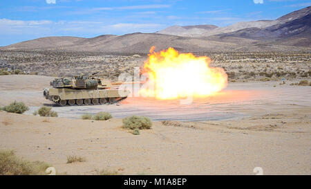 NTC FORT IRWIN - An M-1 Abrams tank belonging to the 1st Battalion, 185th Armor Regiment (Combined Arms Battation) fire rounds down range at National Training Center Fort Irwin. The 185 CAB Soldiers operating the tanks were conducting firing tables as part of their annual training for the California Army National Guard. (U.S. Army photo by Sgt. Nevada Jack Smith) Stock Photo