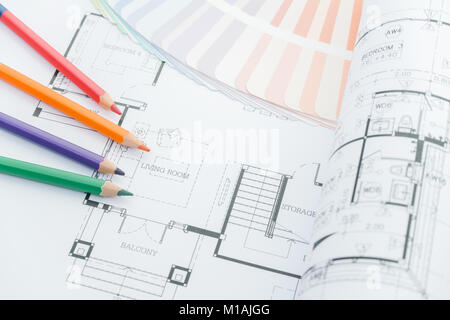 architects workplace - architectural drawings of the modern house with color pencils and sample colors. decoration concept. designer tools. Stock Photo