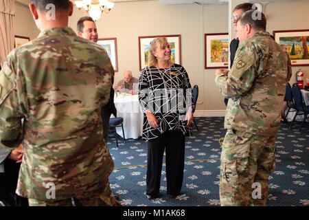 Los Alamitos Mayor Shelley Hasselbrink speaks with U.S. Army Maj. Gen. Mark W. Palzer, Commanding General, 79th Theater Sustainment Command, U.S. Army Reserve, right, Nov. 16, 2017, during a Thanksgiving Appreciation Lunch at Joint Forces Training Base Los Alamitos, California. The 14th annual event brought together elected officials, community leaders, Soldiers, Airmen and family members of deployed troops for a holiday meal on the base. (Air National Guard photo by Senior Airman Crystal Housman) Stock Photo