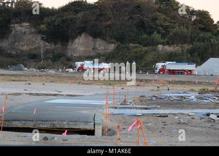 (4 November 2015 , Soma, Fukushima, Japan) A pavement destroyed by Tsunami disaster in Matsukawaura beach, Soma,city Japan. The beach has been closed for swimming due to under construction and decontamination process for 6 years since 2011 Tsunami-earthquake disaster and its aftermath. Soma city is planning to finish the process of reconstruction and decontamination in order to reopen the beach for tourists from 2018 onward. Stock Photo